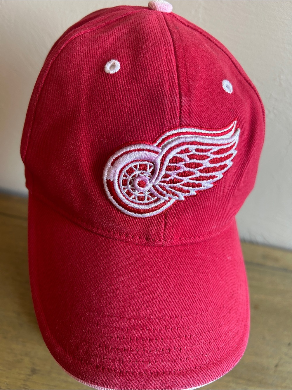 Detroit NHL Red Wings Baseball Cap with White Embroidered Winged Wheel Logo.